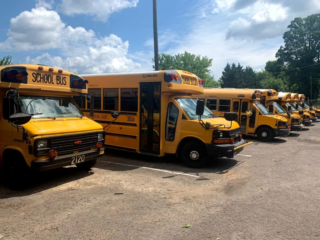 yellow school buses in parking lot